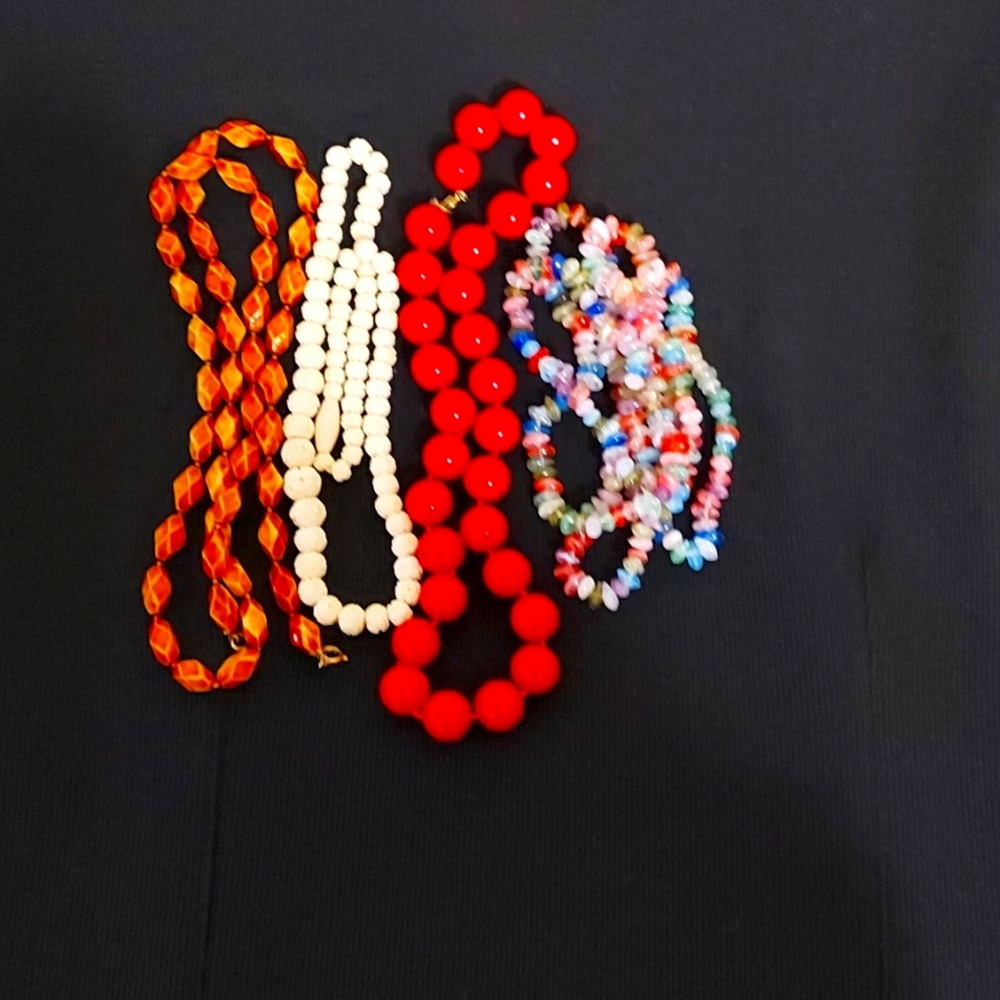 Woman necklaces, no brand, size varies, red. White. Yellow